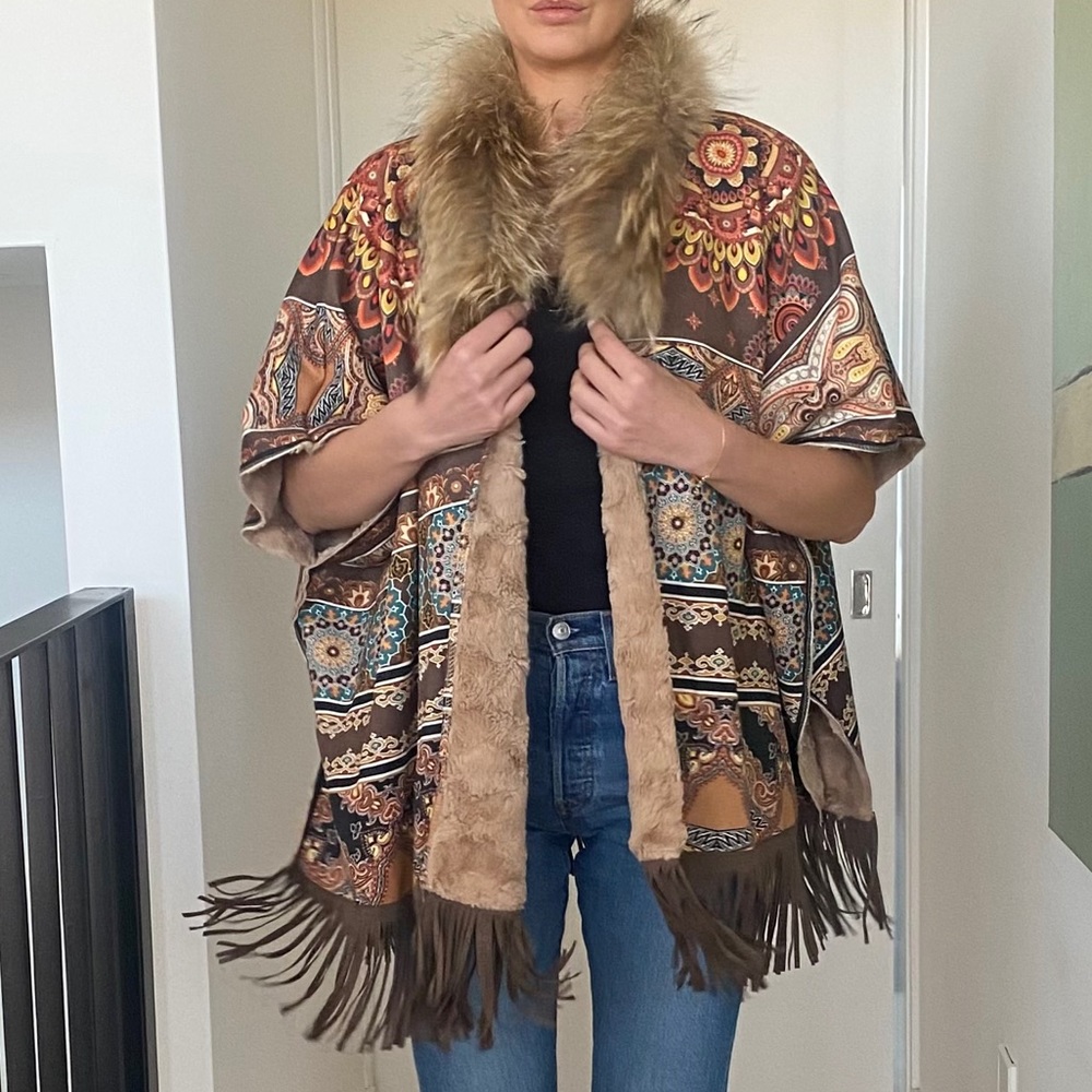 Poncho-cape coat.